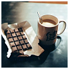 dreams_in_color: bar of chocolate next to a cup of coffee (stock - coffee and chocolate)