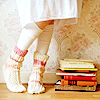 snottygrrl: girl standing by books (books and toes by the_muppet)