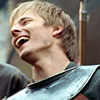 dubhartach: Arthur in armour, head thrown back, big grin (arthur grin)