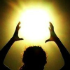 actionreaction: photo of a silhouette of a woman with hands cuppoed over her head, around the sunlight ([shadowbinder] lucent; sun casting)