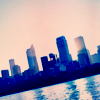 sunspot: skyline of city by water, tilted to one side (tilted skyline)