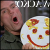 highlander_ii: Jack O'Neill holding up a plate with a smiley face drawn on it in mustard and ketchup with the backwards text 'wacko!' ([O'Neill] 006)