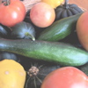 metawidget: a basket of vegetables: summer and winter squash, zucchini, tomatoes. (food)