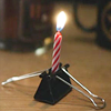 pipisafoat: a lit candle held in a binder clip (candle)