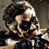 halialkers: Man with grey temples in hair clutching gun, masked, smiling (Edward)