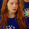 bookblather: Annalise Basso looking to the left of the camera, with long red hair and a blue shirt. (in the heart: young ivy)