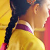 amihan: medium shot of shin min ah as arang in 'arang & the magistrate', long hair in a braid, dressed in yellow hanbok ([arang & the magistrate] arang braid)