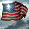 silveraspen: american flag against the sky with the sun shining through the field of stars (land of the free)