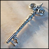 silveraspen: antique silver key on cream-colored sand (unlock the mystery)
