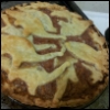 pie: top crust made with cookie-cutter dinosaurs and a bomb (dinosaur bomb)