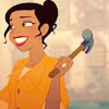amayakumiko: black girl with her hair in a wispy bun hold a hammer in her hand with a large grin on her face. (Default)
