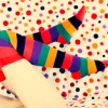 meloukhia: A pair of legs in stripy socks, waving gleefully against polkadot wallpaper (Stripy socks)