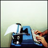 elaineofshalott: Two hands on a deep-blue typewriter. (selectric blue)