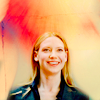 purpleyin: Brightly coloured background with Olivia Dunham looking happy and smiley (light)