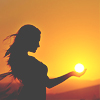 dchan: A silhouette of a woman appearing to hold the sun in her hands (hold the sun in my hands)