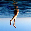 jesse_the_k: Water above, pair of white woman's legs dangling from thigh into sky below (Walking in sky)