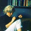 innocentsmith: marilyn monroe sitting under a shelf of books, writing (marilyn journaling)