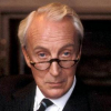 mightthinkthat: Promo: Francis with glasses looking out at the camera looking flirty and cheeky (flirtatious look)