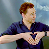 kabal42: Tom Hiddleston making the <3 sign with his hands (Tom Hiddleston - <3 hands)