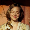 lark_in_flight: Cosette smiling down, eyes closed, in private happiness or smug satisfaction (a heart full of joy)