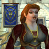 helens78: A female dwarf with long brown braids stands in front of a blue banner with a gold lion on it. (wow: ovistine)
