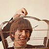 oftheuniverse: George Harrison of the Beatles with his head in a birdcage. (Beatles ♥ Captured the VampBeatle)