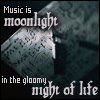 paintbynote: sheets of music in a sliver of moonlight, text reads "Music is moonlight in the gloomy night of life" (Music is Moonlight)