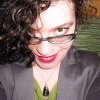 emmakatharine: Portrait of the artist grinning worryingly. (rather too many teeth)