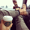 alwayswondered: A girl sits with her feet up holding a Starbucks takeaway cup in one hand. (grande vanilla cappuccino extra hot)