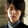 reka: A teenager in a suit with an emotionless expression. (Nowhere close)