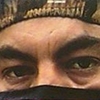 aaaaaaaagh_sky: Eyes of a First Nations man bordered on top by camo and below by a black face mask (Canada - Border Patrol)