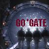monksandbones: SG-1 from behind in silhouette, climbing the ramp toward the active stargate, text reads "GO 'GATE" (go 'gate)