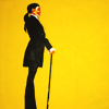 meloukhia: A figure in profile against a yellow background with a cane and a pulled-back hairstyle (Profile with cane)