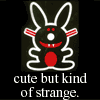 trinker: black bunny with red belly, from jimbenton.com, with the caption "cute but kind of strange!" (cute but kind of strange)