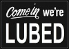 multikinkmemes: Sign with the words "Come in, we're lubed" in white on black. (Lubed)