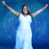 amadi: Queen Latifah in an ankle length white sleeveless dress, raises both hands over her head triumphantly, smile on her face (\o/)