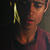 amihan: close-up of alfred enoch as wes gibbins (how to get away with murder), wearing a dark red shirt, looking down ([htgawm] wes gibbins)