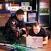 enigel: Sheppard and McKay huddled around McKay's laptop (SGA McShep laptop love (by me))