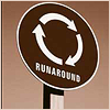 flo: A brown sign with 'runaround' on it. (Runaround)