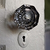 wintergrey: The glass knob and keyhole of an old door. (Behind this door.)