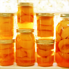 sporky_rat: Jars of orange fruit, backlit (food)