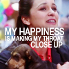 metatxt: amy santiago holds puppies while looking slightly pained. text reads: my happiness is making my throat close up (b99: happiness throat close up)