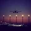 alwayswondered: An aeroplane taking off into a night sky. (here I am on the road again)