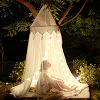 majoline: girl in a tent with fairy lights strung around the perimeter (tent light)