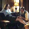 isagel: Edwin Jarvis tending to a wound on Peggy Carter's thigh. He's on his knees beside her, she watches him work.. (agent carter tending wounds)