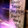 frith_in_thorns: Sign reading "Really really dangerous don't touch - McKay" (SGA Danger sign)