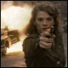 rhi: Peggy Carter pointing a gun at the viewer while a car explodes behind her (Peggy Carter)