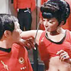 muccamukk: Uhura, in her Mirror Universe uniform, brandishes a knife while leaning suggestively against Mirror!Sulu's shoulder. (ST: Mirror Mirror)