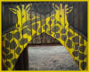 froganon: two painted giraffes on a structure at a playground (two giraffes)