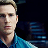 longwhitecoats: Steve Rogers in a blue button-down shirt looking serious (Steve serious)